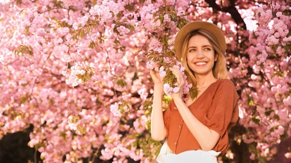 woman watching cherry blossoms in spring